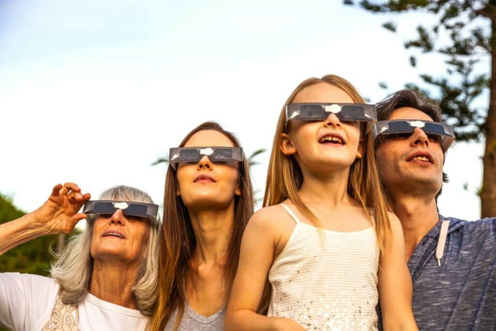 Family watching an eclipse