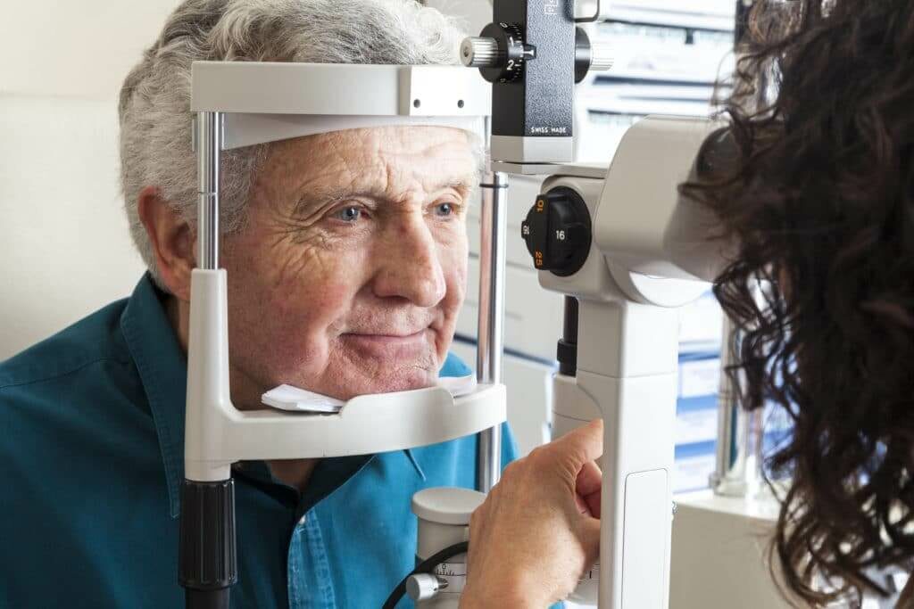 Older man having his eyes examined