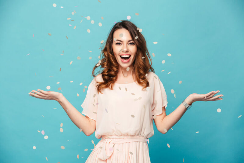 Happy woman with confetti