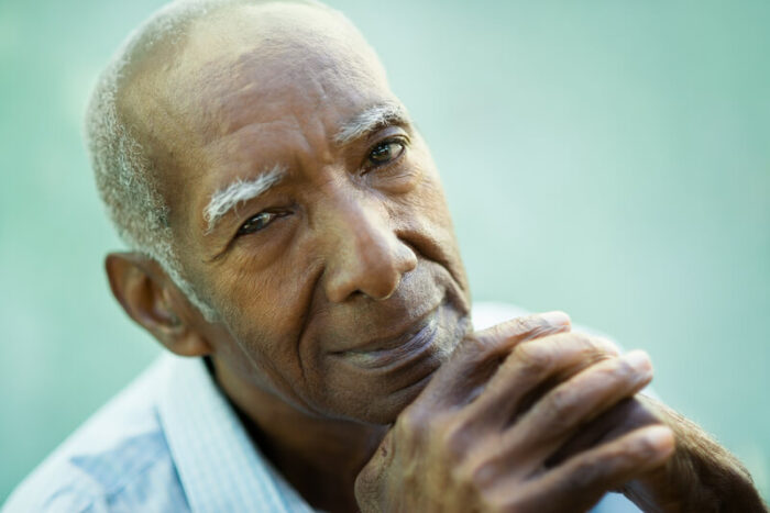 Portrait of happy senior man looking at camera