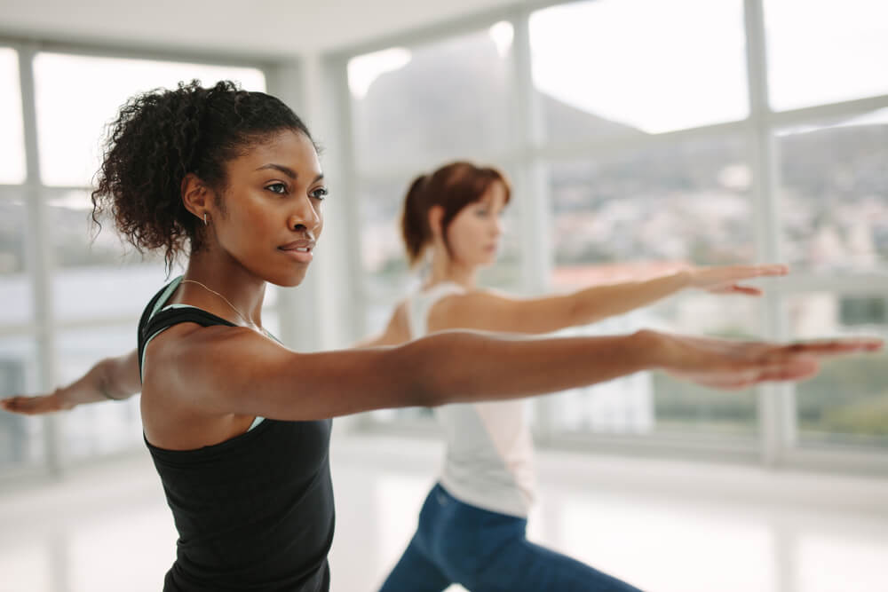 Women in their 30s doing yoga