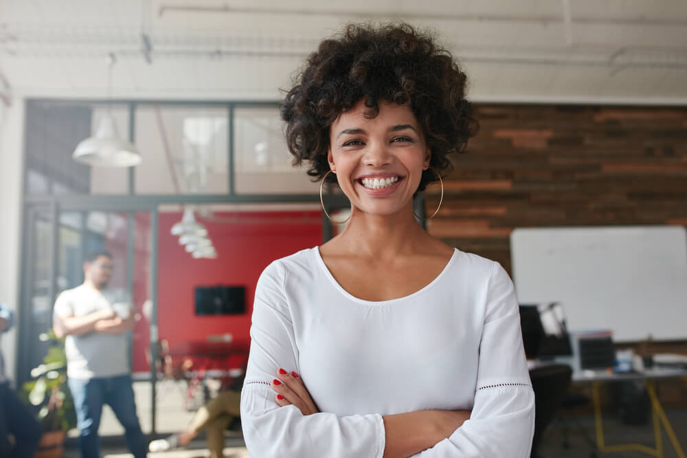 Young happy woman smiling at camera.