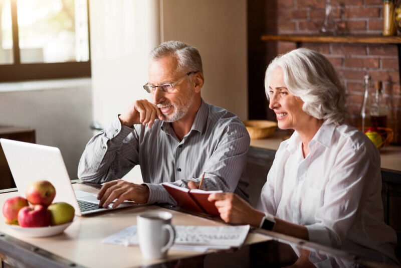 Senior couple looking at computer